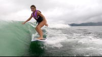 a young lady wakesurfs on lake arenal
 - Costa Rica