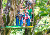 Kid Riding By Herself From A Tree Platform Tizati Zip Line Rincon De La Vieja
 - Costa Rica