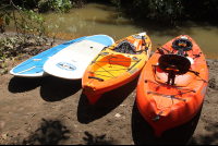 paddles kayaks at break
 - Costa Rica