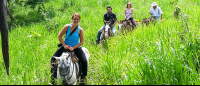 Horseback Riders Going Up A Hill
 - Costa Rica