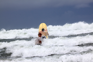 lagarto surf company in the waves 
 - Costa Rica