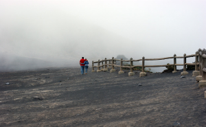 irazu couple walking in fog  
 - Costa Rica