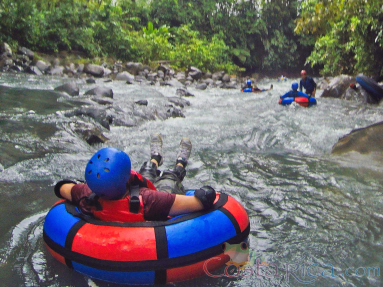 Kid On An Inner Tube Floating Toward The Currents Blue River Rincon De La Vieja
 - Costa Rica