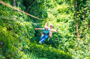 Lady Riding With A Guide Superman Style Tizati Zip Line Rincon De La Vieja
 - Costa Rica