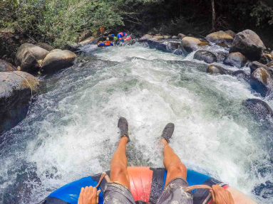 White Water And People Floating In Front Rio Negro Tubing Rincon De La Vieja
 - Costa Rica