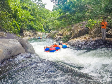 Sliding On Rock Surfaces Rio Negro Tubing Rincon De La Vieja
 - Costa Rica