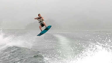 a man up in the air wakeboarding on lake arenal
 - Costa Rica
