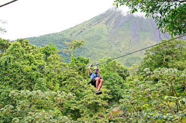 Zip Lining With Arenal Volcano Base In The Background Los Canones Canopy Tour La Fortuna
 - Costa Rica