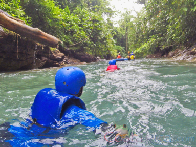 Wading In The Blue River To Get Inner Tube Rincon De La Vieja
 - Costa Rica