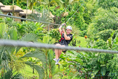 Flying Above The Resort Los Lagos On A Zip Line Los Canones Canopy Tour La Fortuna
 - Costa Rica